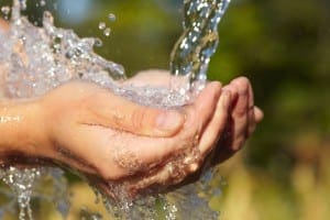 Hands Catching Flowing Water